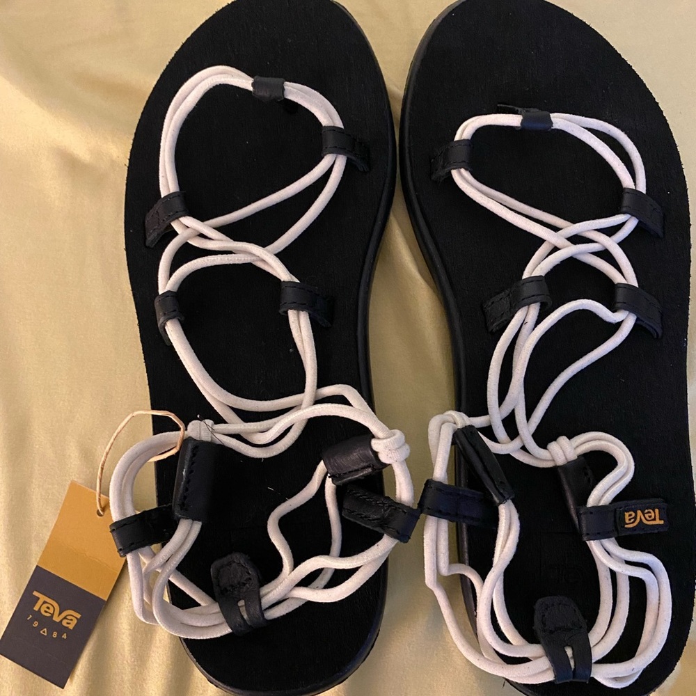 Teva Sandals New with tags. Black and White